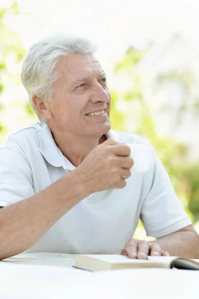 Man reading interesting book — Stock Photo, Image