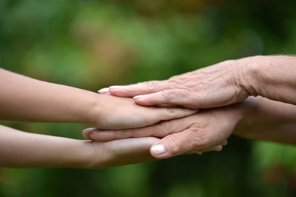 Granddaughter Grandmother Holding Hands Outdoors — Stock Photo, Image