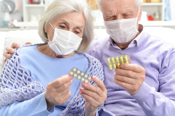 Portrait Sick Elderly Woman Man Facial Masks Holding Pills — Stock Photo, Image
