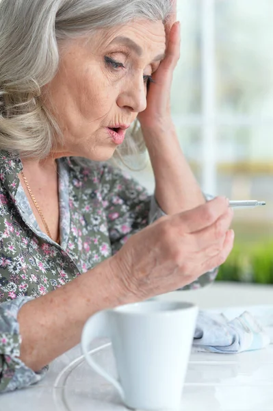 Sick Senior Woman Sitting Table Home Thermometer — Stock Photo, Image