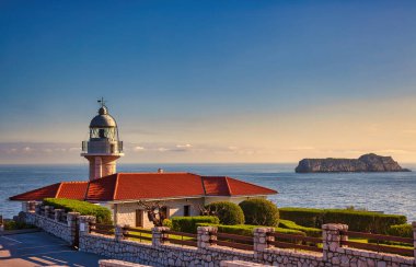 Suances lighthouse  at sunrise image clipart