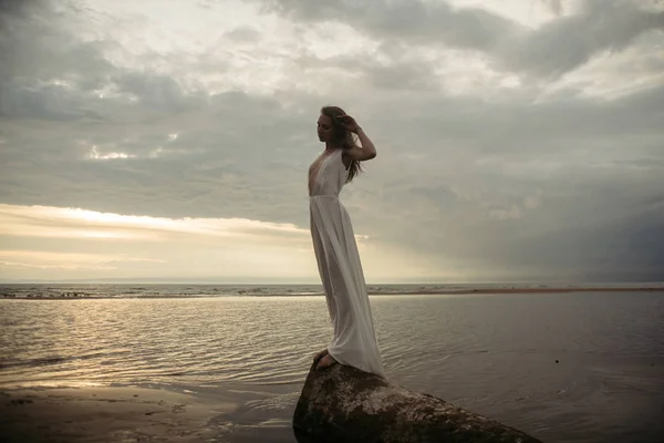 Girl in white dress in the sea — Stock Photo, Image