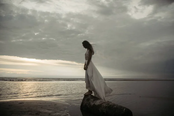 Girl in white dress in the sea — Stock Photo, Image