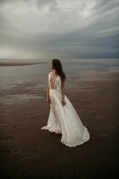 Girl in white dress in the sea — Stock Photo, Image