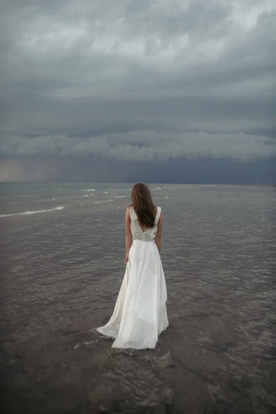 Girl in white dress in the sea — Stock Photo, Image