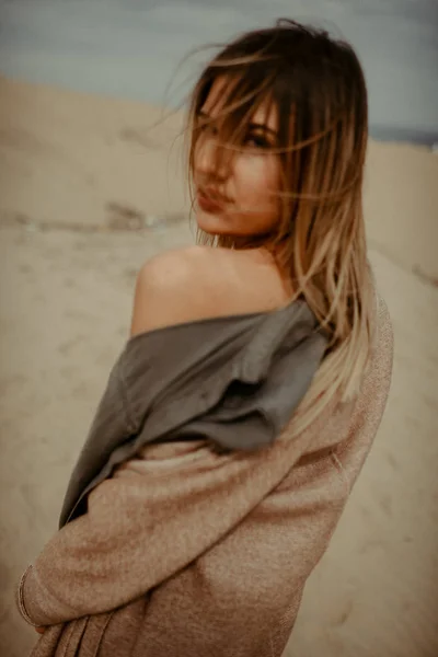 Woman with fit body portrait in desert