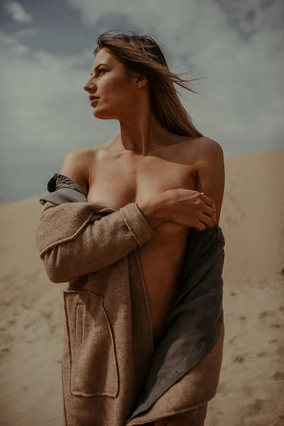 Woman with fit body portrait in desert