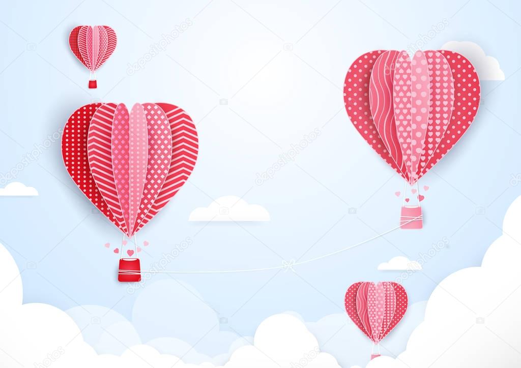 Hot air balloons in shape of heart flying in clouds. paper art