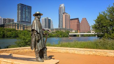 Stevie Ray Vaughan Sculpture in Front of Downtown Austin, Texas  clipart