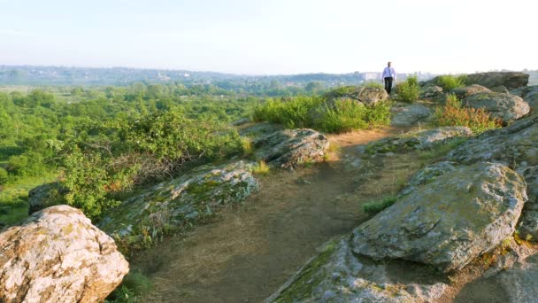 Businessman goes on hill top. 4K 3840x2160 — Stock Video