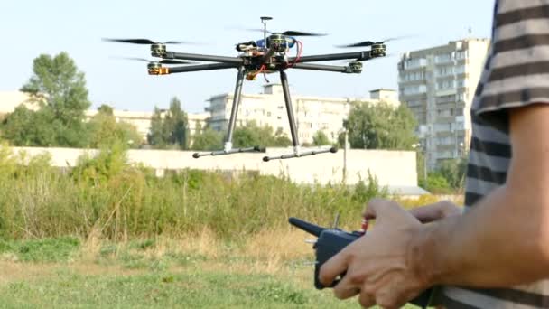 Pilot's hands with  radio transmitter,  operate of drone with eight propeller .4K 3840x2160 — Stock Video