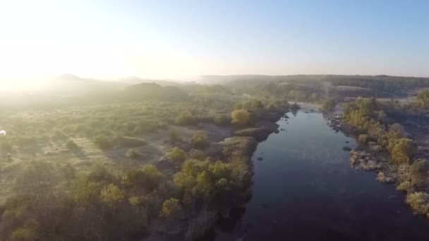 Aerial. Flight over  morning river  with beams of sun — Stock Video
