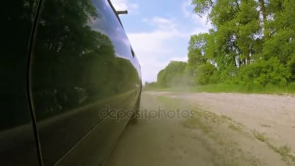 Dusty rural road and car. POV clip — Stock Video