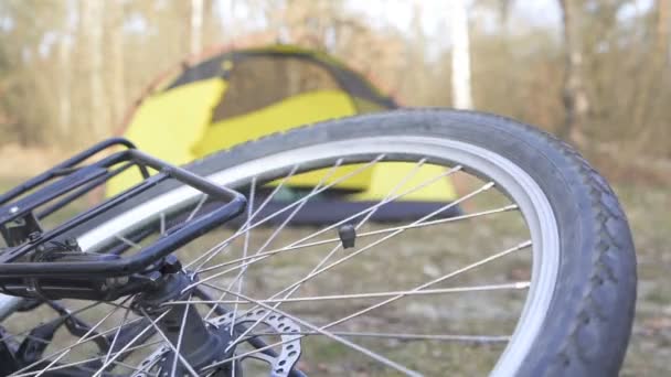 Bike Wheel Rotates Yellow Tourist Tent Symbol Outdoor Travel Slow — Stock Video