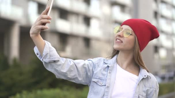 Young Pretty Girl Red Cap Glasses Use Smartphone Selfie City — Stock Video