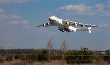 Gostomel, Ukraine - April 11, 2020: The plane Antonov 225 AN-225 Mriya, the biggest airplane in the world taking off from the airport. Largest aircraft flying in the sky. Antonov airlines. clipart