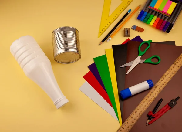 Step 1. Step-by-step instructions on how to make a stand for stationery from recycled materials. Do it yourself. A glass for pencils and pens from a plastic bottle and a can. A fun craft for kids. DIY