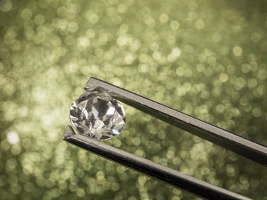 Valuable diamond is examined clipart