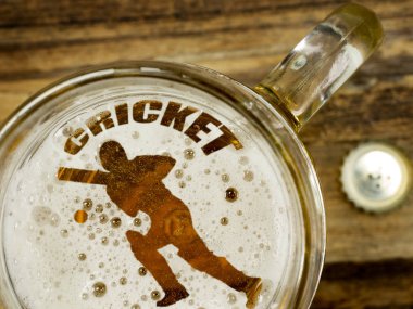 Cricket player in beer foam clipart