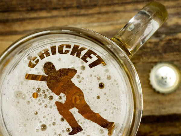 Cricket player in beer foam — Stock Photo, Image