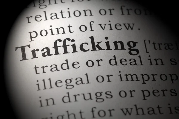 Woordenboekdefinitie van mensenhandel — Stockfoto