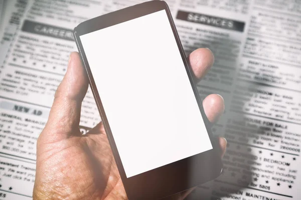 Falso giornale e smartphone — Foto Stock