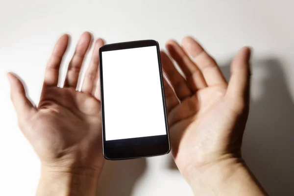 Mobiel en onscherpte handen — Stockfoto