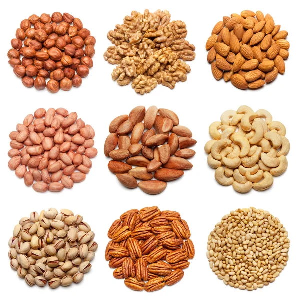 Samling av olika nötter på vit. — Stockfoto