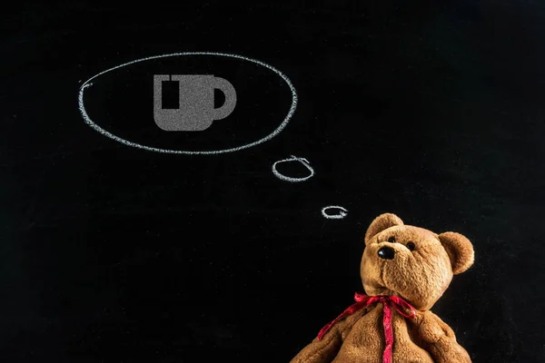 Le rêve d'un ours en peluche. Ours en peluche avec tasse de thé icône — Photo