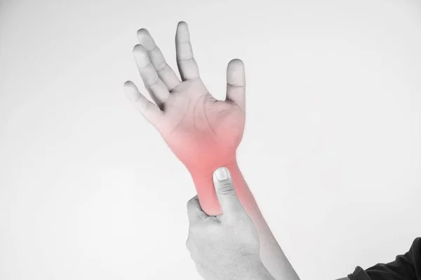 Wrist injury in humans .wrist pain,joint pains people medical, mono tone highlight at wrist — Stock Photo, Image