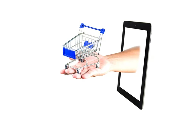 Carrinho de compras na mão com Tablet no fundo branco — Fotografia de Stock