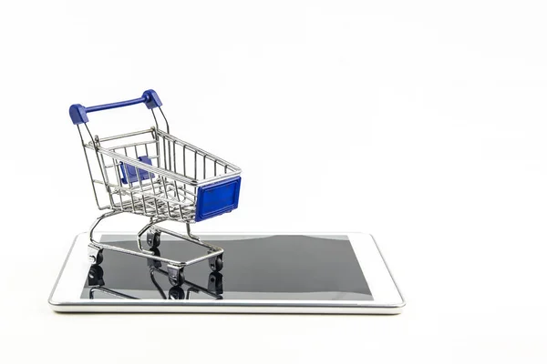 Shopping cart with tablet on white backgrond , Means shopping on — Stock Photo, Image