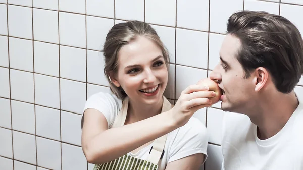 Women are feeding fruit to men. Concept lover  couple