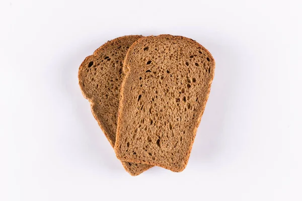 Two slices of brown bread on white background — Stock Photo, Image