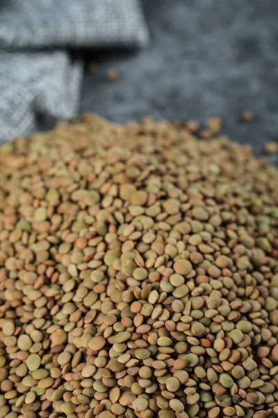 Green fresh and healthy lentil on the bottom side of the background — Stock Photo, Image