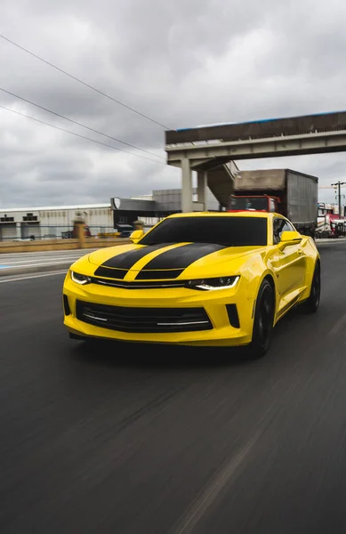 Yellow sport car with black stripes on it — Stock Photo, Image