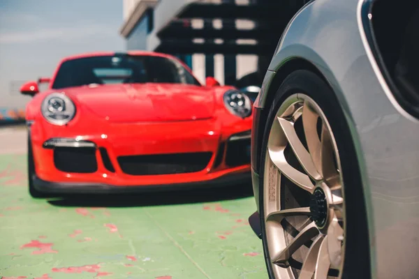 Brand new red sport car in parking mode — Stock Photo, Image