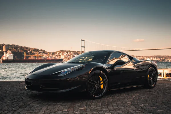 Luxury black sport sedan parked at the port — Stock Photo, Image