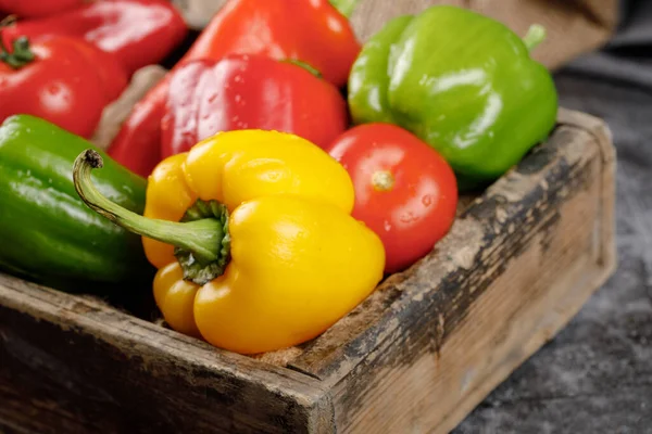 Yellow, green and red bell peppers.