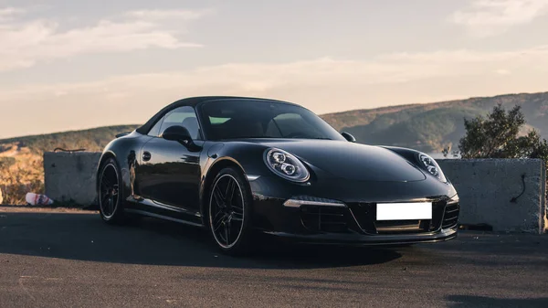 Black sport coupe parking on the road — Stock Photo, Image