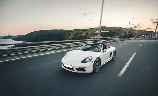 White super model car driving at the seaside — Stock Photo, Image
