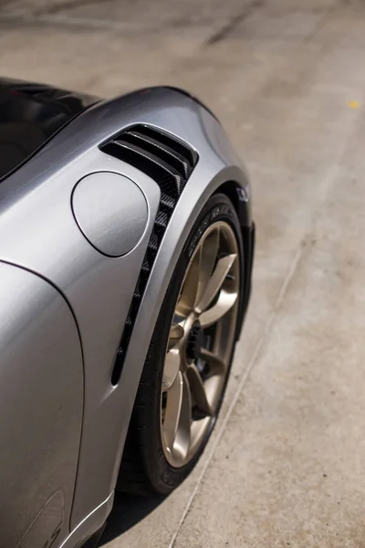 Silver sport car with black autotuning,back gas pipe and wheel — Stock Photo, Image