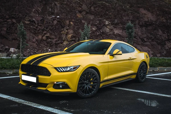 Yellow sport model car on the parking zone with black tuning — Stock Photo, Image