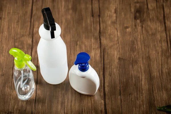 Hand sanitizers around in white containers — Stock Photo, Image