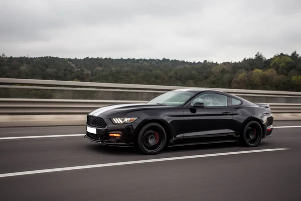 Black sport sedan rush drive on the highway — Stock Photo, Image