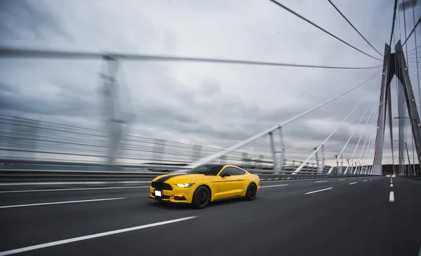 Yellow turbocar motion speed test on the bridge — Stock Photo, Image