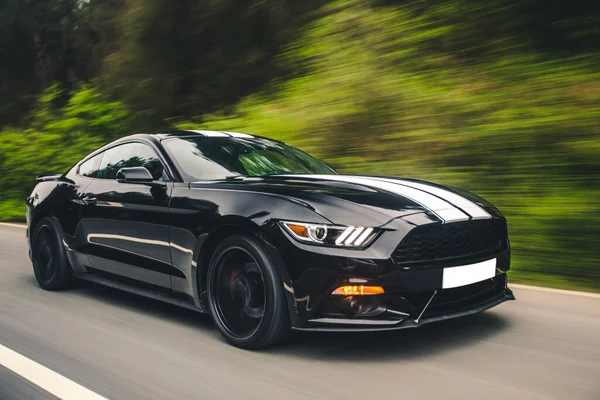 Black sport sedan with white autotuning in the countryside — Stock Photo, Image