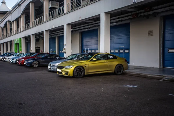 Sport sedans on the parking in front of a performance center — Stock Photo, Image