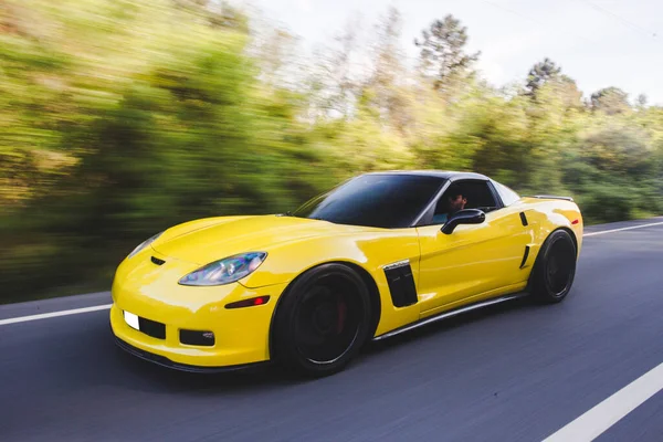 Yellow super racing car in the forest — Stock Photo, Image