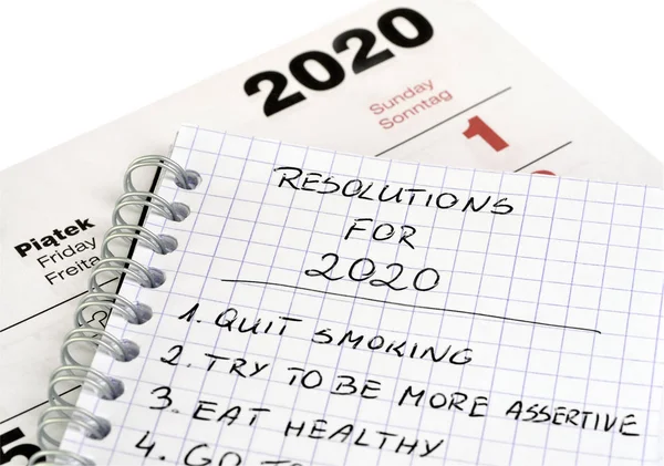 New Year's resolutions in a notepad — Stock Photo, Image